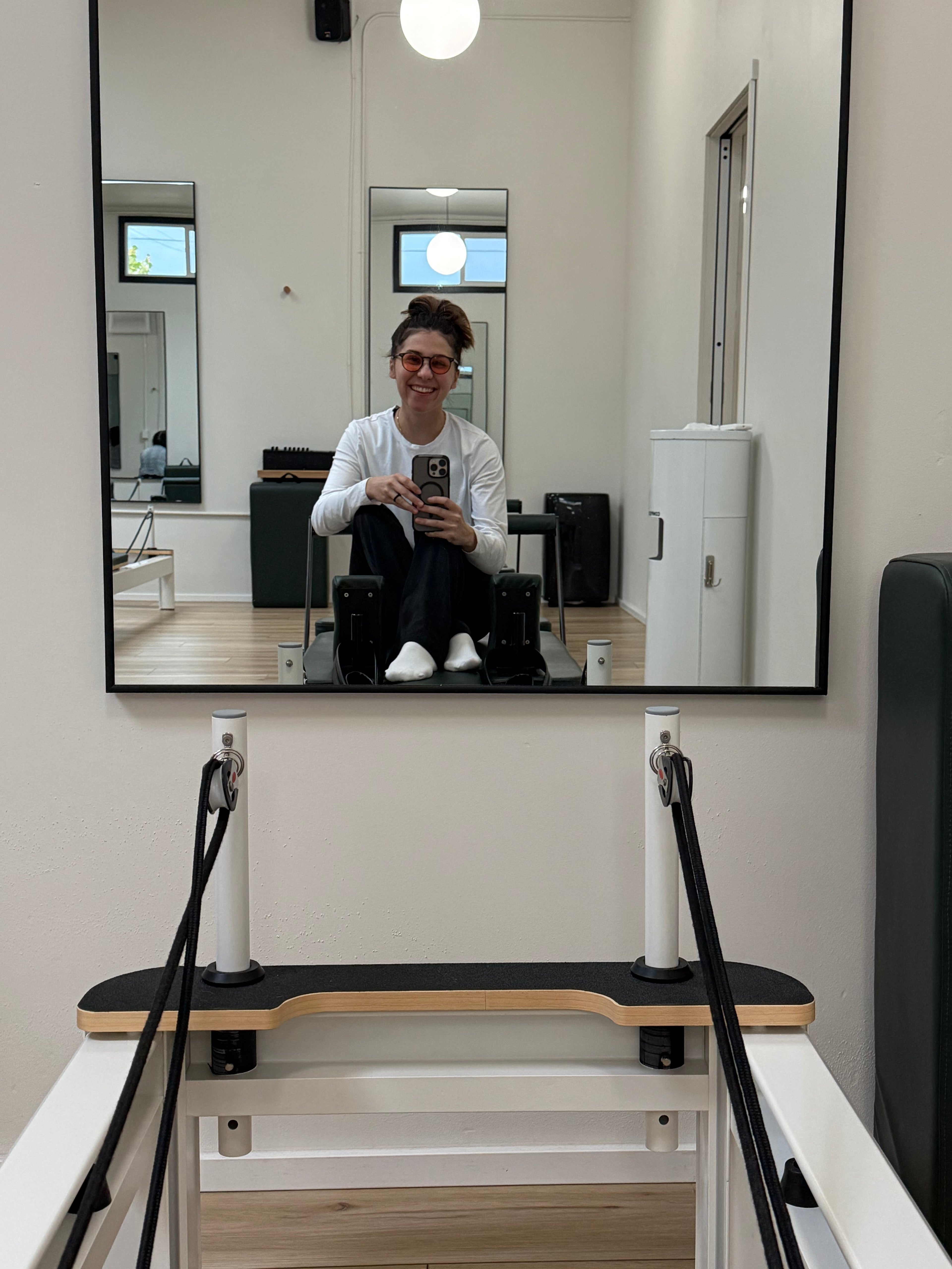 Women on pilates reformer